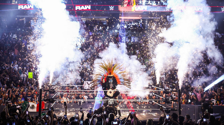 Penta in the ring in full entrance garb while pyro goes off on "WWE Raw"