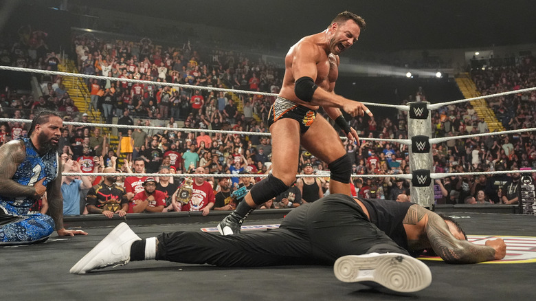 Jimmy Uso stares at LA Knight, pointing at a fallen Jey Uso on "WWE Raw"