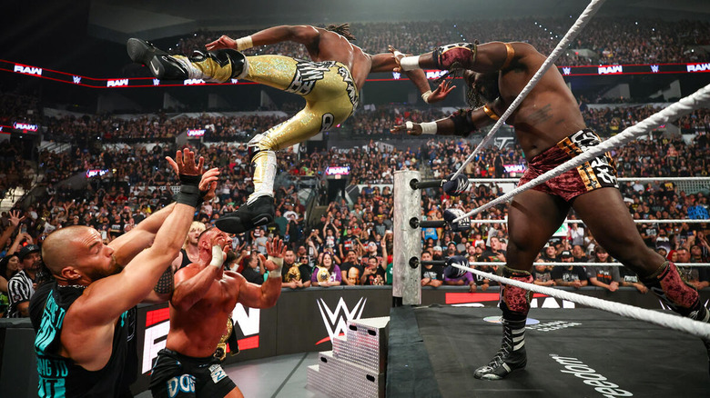 Oba Femi throws Je'Von Evans over the top rope onto the Vision on "WWE Raw"