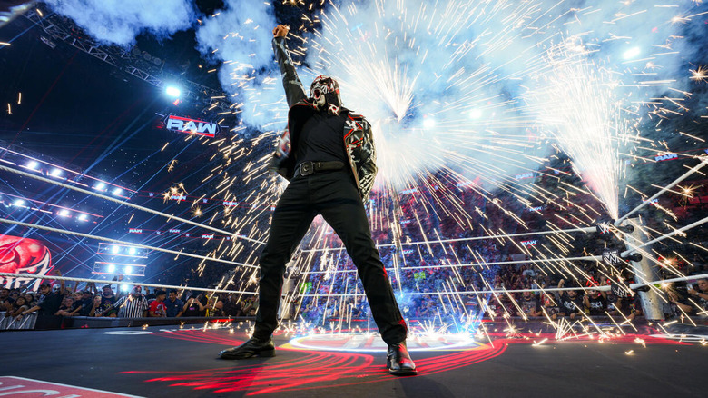 Penta stands in the ring as pyro goes off behind him on "WWE Raw"
