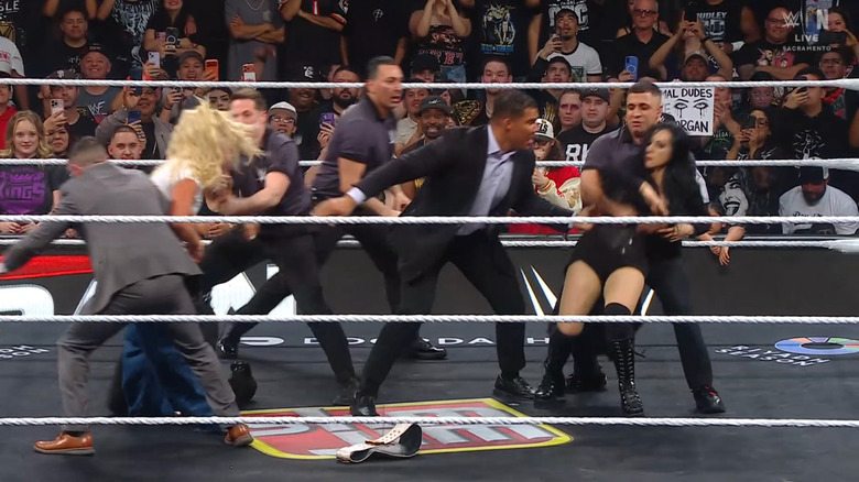 Morgan and Vaquer brawling with one another