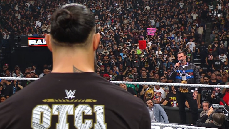 Reigns and Punk staring each other down
