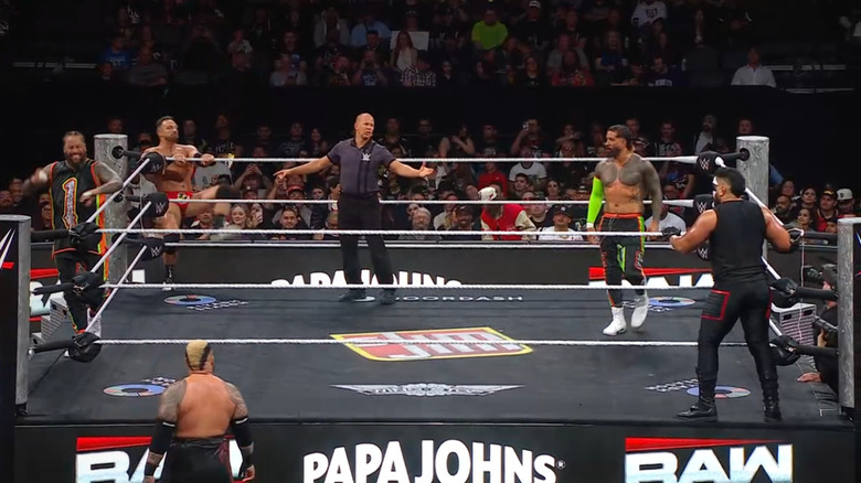 Jimmy, Knight, Sikoa, Jey, and Loa in the ring