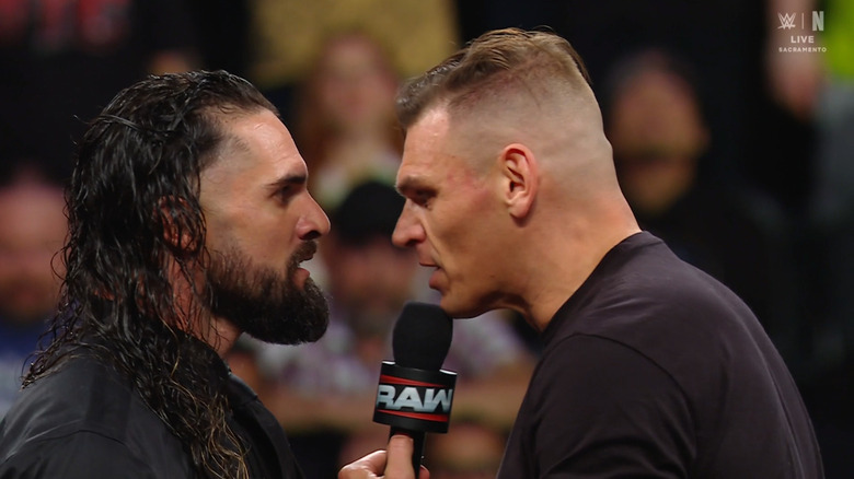 Rollins and GUNTHER staring down one another in the ring
