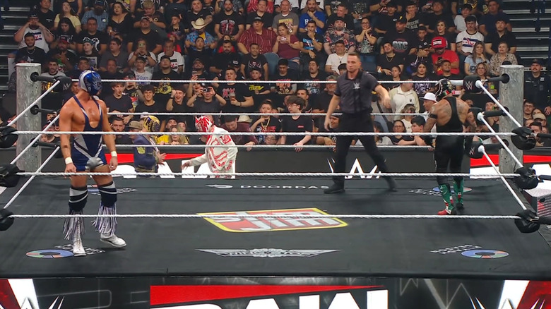 Grande and Rey staring one another down