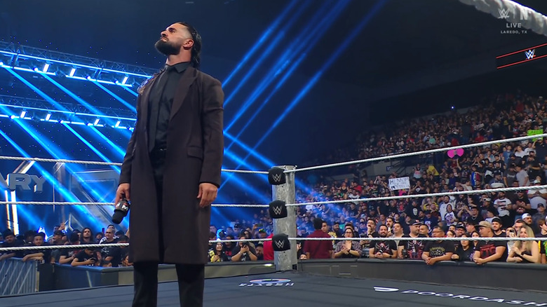 Rollins standing in the middle of the ring