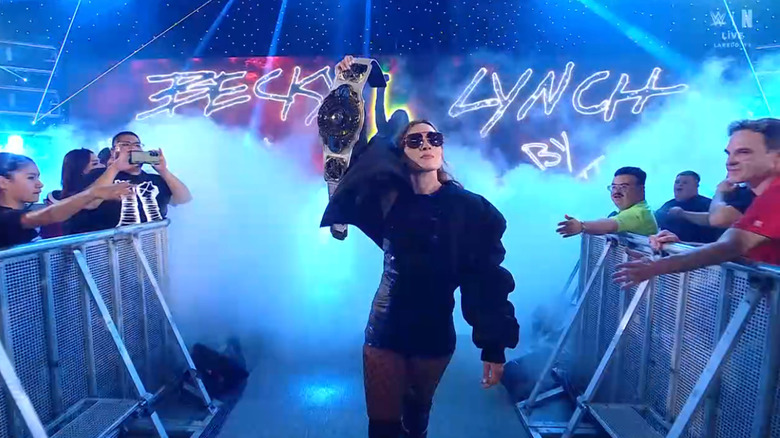 Lynch holding up her Women's Intercontinetal Championship on the entrance ramp