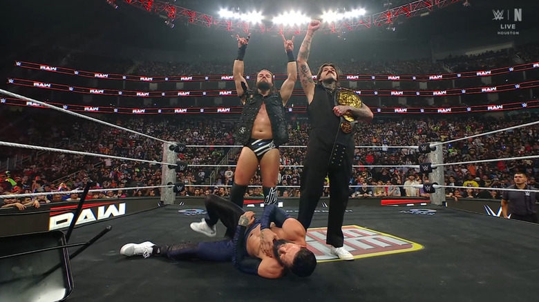 McDonagh and Dominik standing over Balor