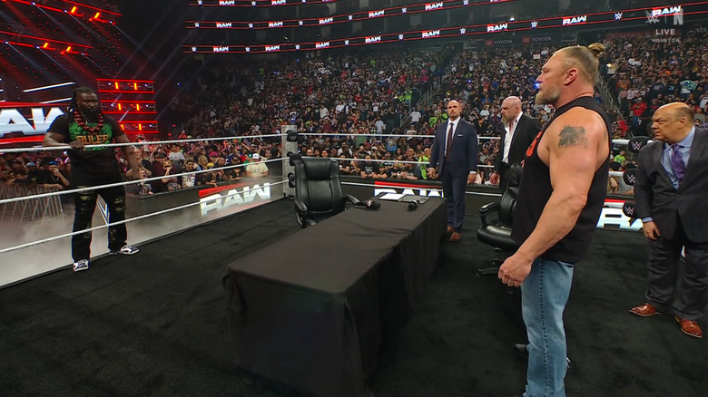 Femi and Lesnar staring one another down