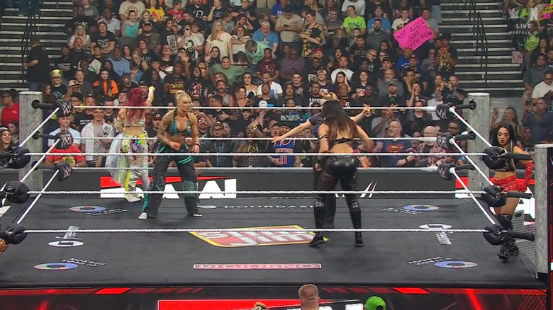 All four women in and around the ring