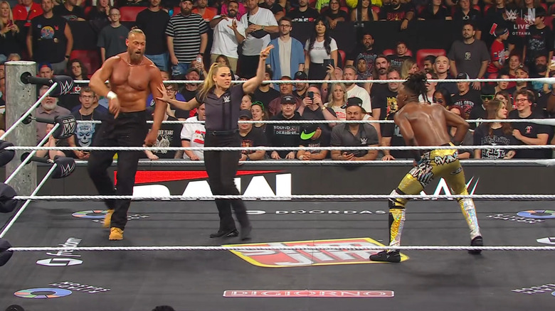 Cass and Evans staring down one another inside the ring