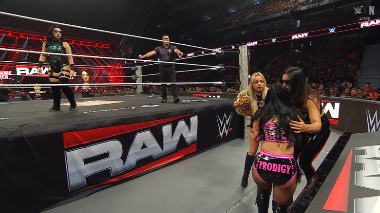 Vaquer staring down Judgment Day on the outside of the ring as they regroup