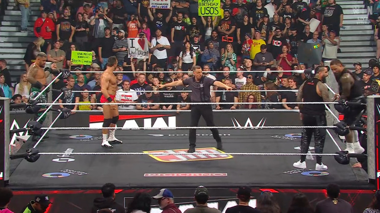 All four men inside and around the ring