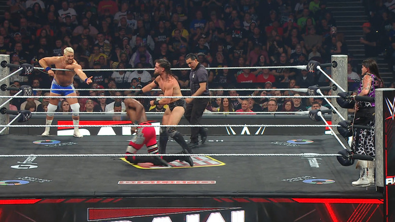 All four men inside and around the ring