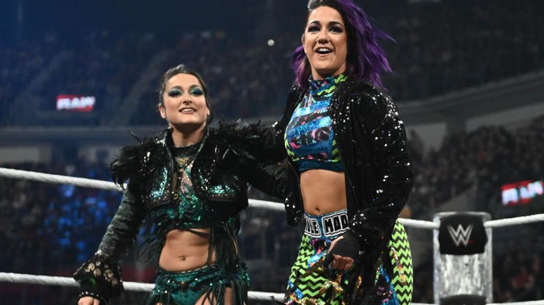 Bayley and Lyra Valkyria smile as they enter the ring for a tag team match on an episode of "WWE Raw."