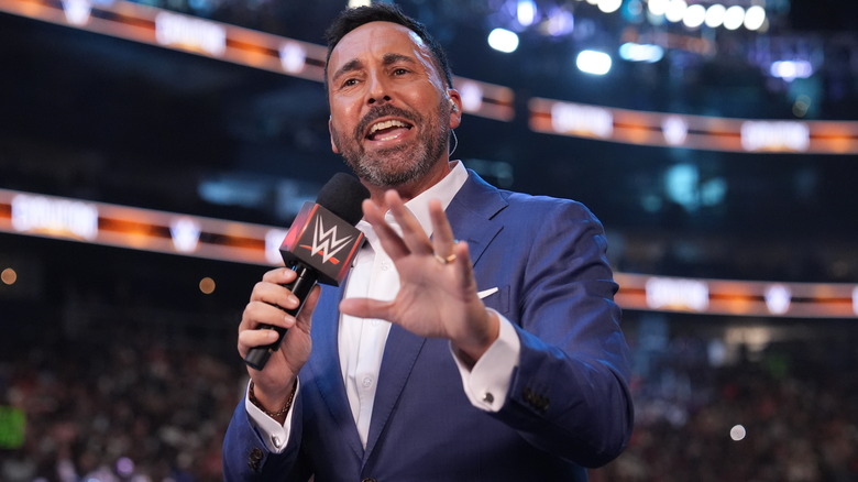 Joe Tessitore speaks into the microphone during 