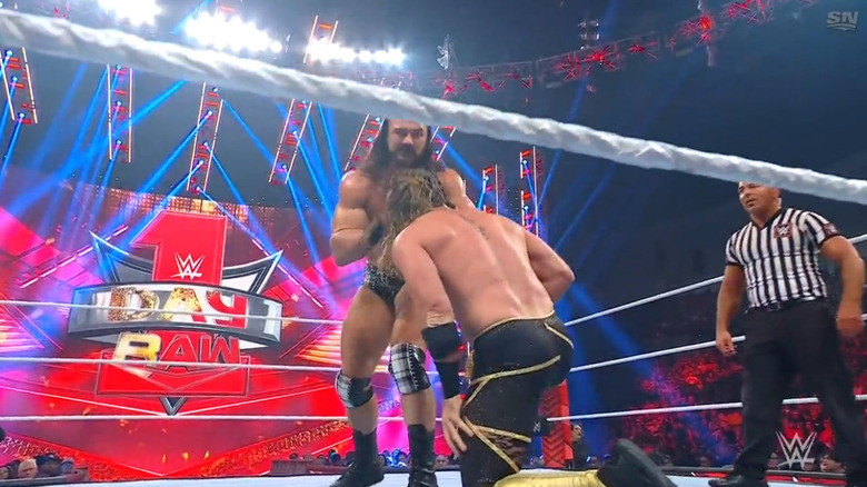 Rollins and McIntyre in the ring