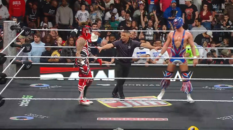 Penta and Grande staring down one another in the ring