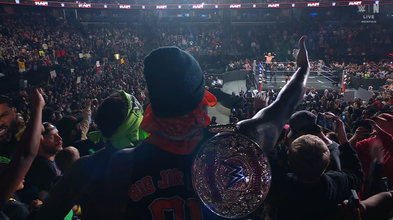 The Usos staring down The Vision in the ring from the crowd