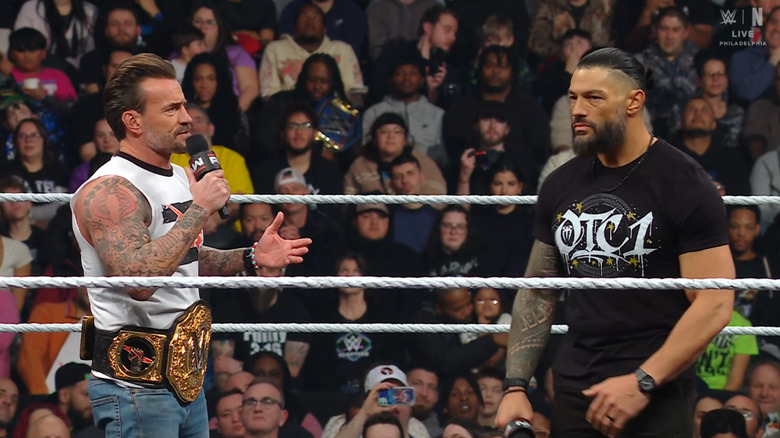 Punk and Reigns both in the ring talking