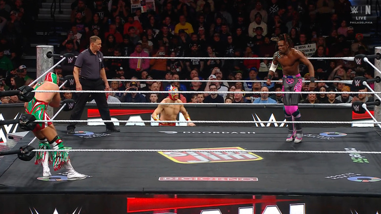 Grande and Evans staring down one another in the ring