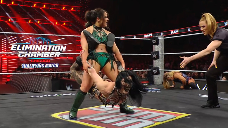 Valkyria with a modified Bow and Arrow on Ripley as Nile slides back into the ring