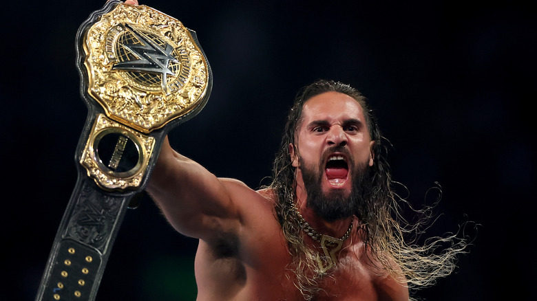 Seth Rollins celebrates after winning the WWE World Heavyweight Championship after cashing in his Money in the Bank contract to take on CM Punk during the WWE 2025 SummerSlam at MetLife Stadium on August 02, 2025 in East Rutherford, New Jersey.
