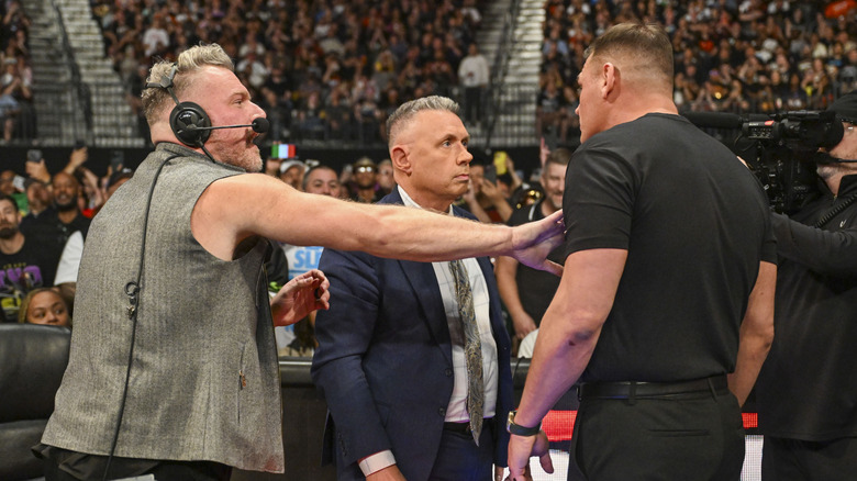 Pat McAfee, Michael Cole, and Gunther in a very awkward spot