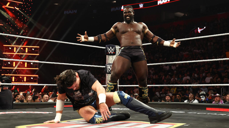 Oba Femi poses above a battered JD McDonagh on "WWE Raw"