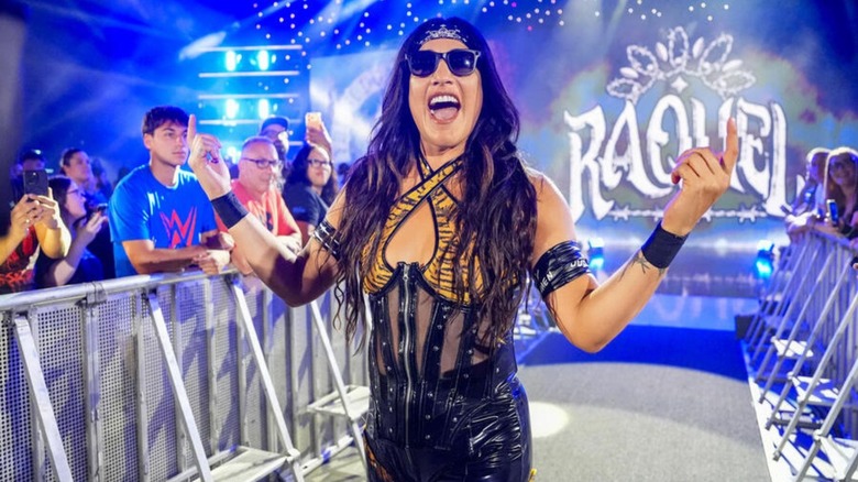 Raquel Rodriguez poses as she heads down the ramp to the ring for a match on WWE programming.