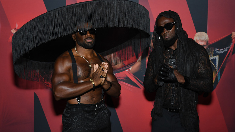 Xavier Woods and Kofi Kingston in mourning