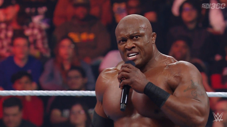 Lashley with a mic in hand