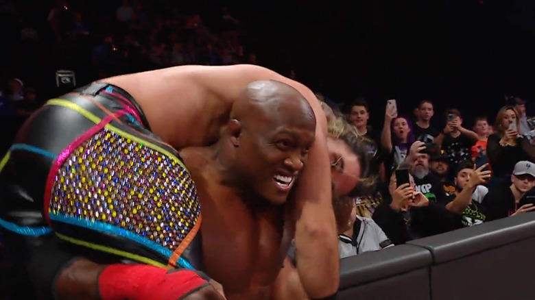Lashley with Rollins on his shoudlers