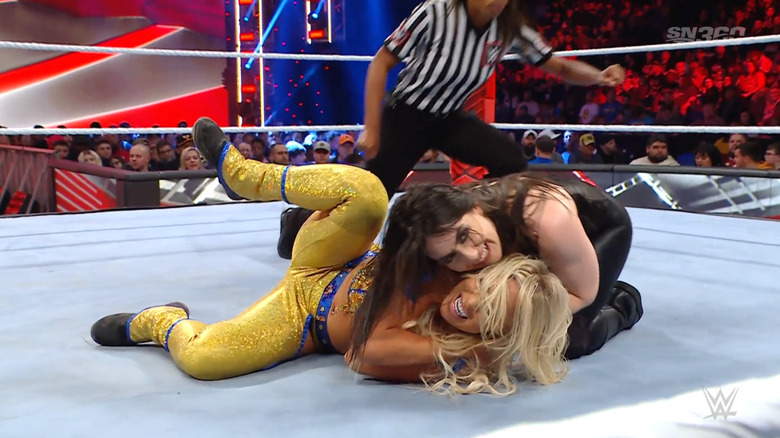 Cross locking in a submission on Brooke while smiling