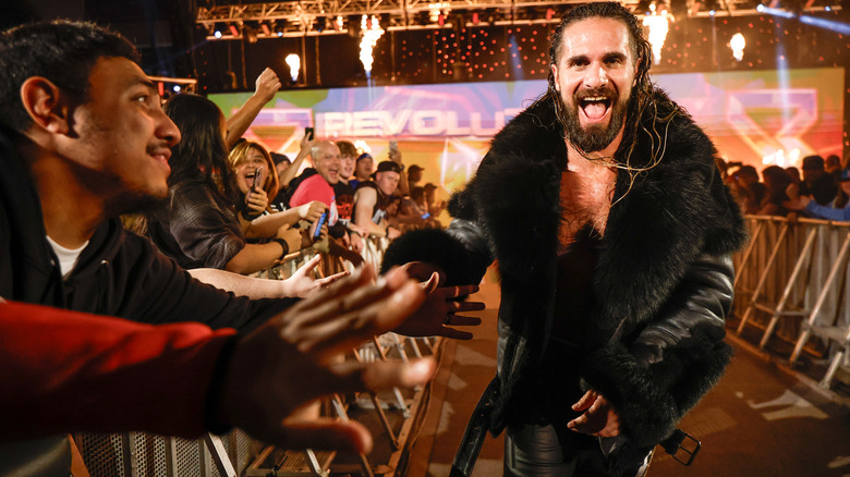 Rollins giving fans high fives