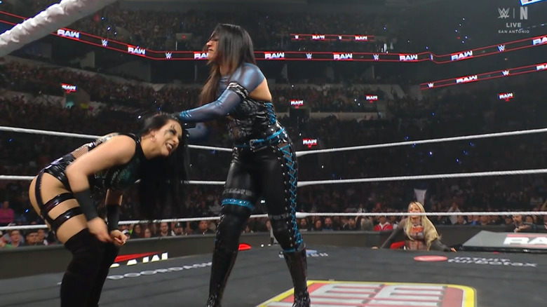 Rodriguez and Vaquer in the ring as Morgan watches from the outside