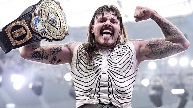 Dominik posing with his Intercontinental Championship belt