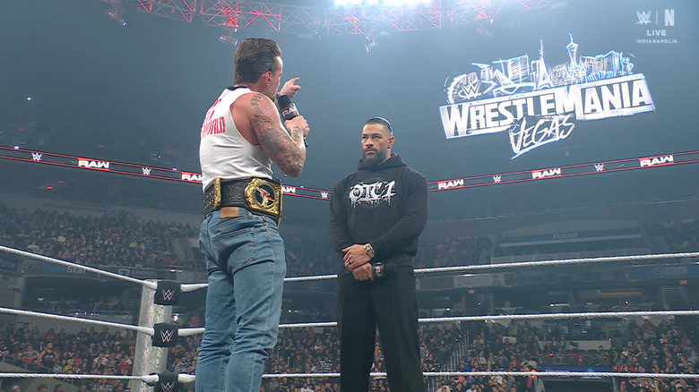 Punk and Reigns speaking in the ring