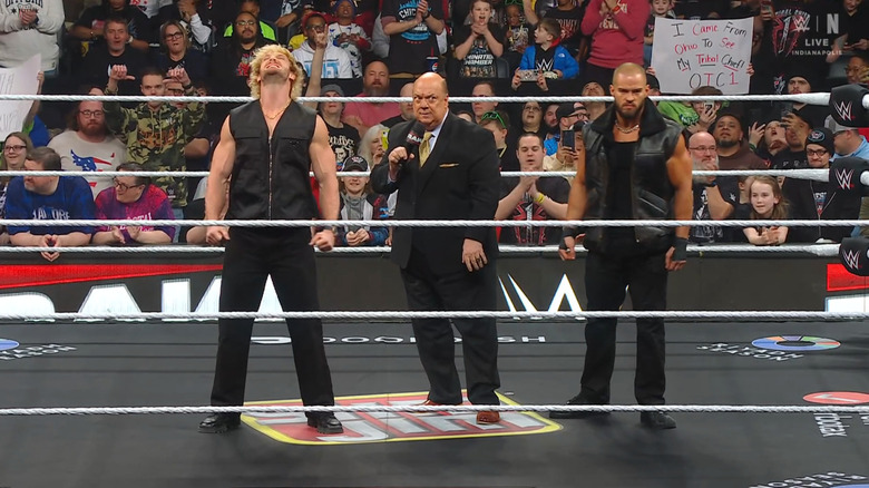 Paul, Heyman, and Theory standing in the ring