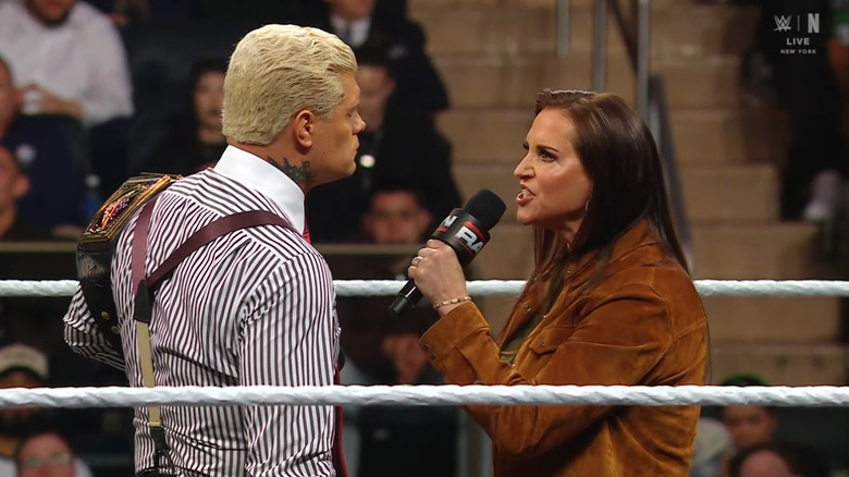 Rhodes and Stephanie speaking in the ring