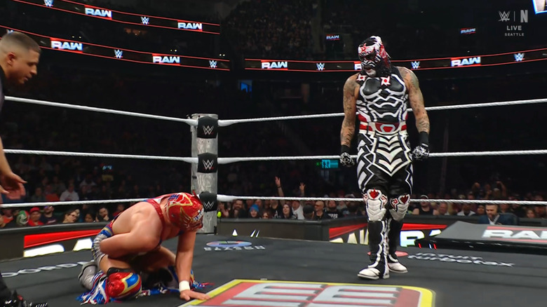 Penta standing over Grande