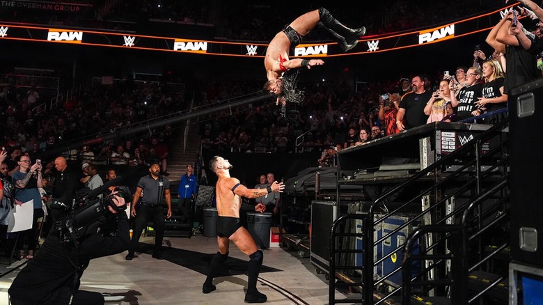 JD McDonagh hits a moonsault on Finn Balor outside the ring on 