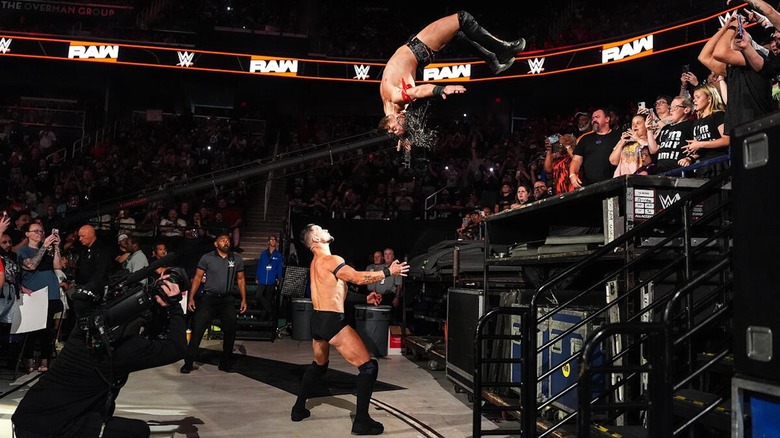 JD McDonagh hits a moonsault on Finn Balor outside the ring on 
