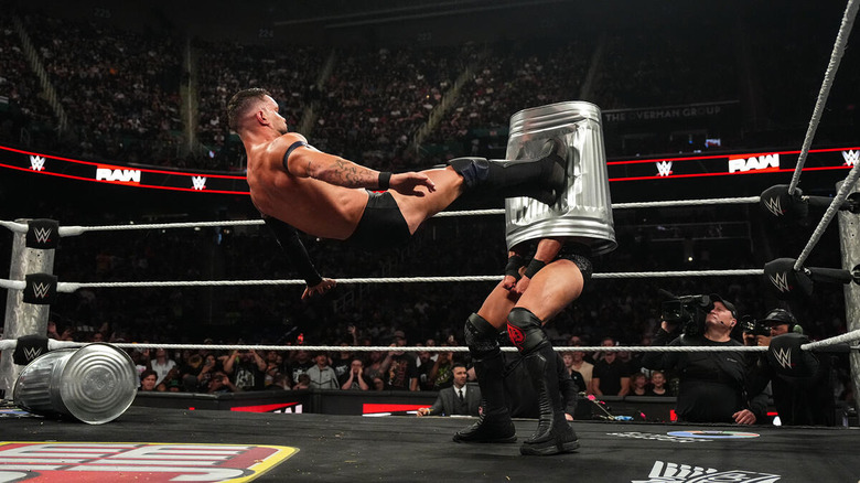 Finn Balor dropkicks a trash can with JD McDonagh inside it on "WWE Raw"