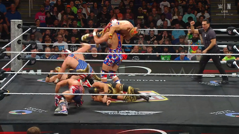 All six men brawling with one another in the ring