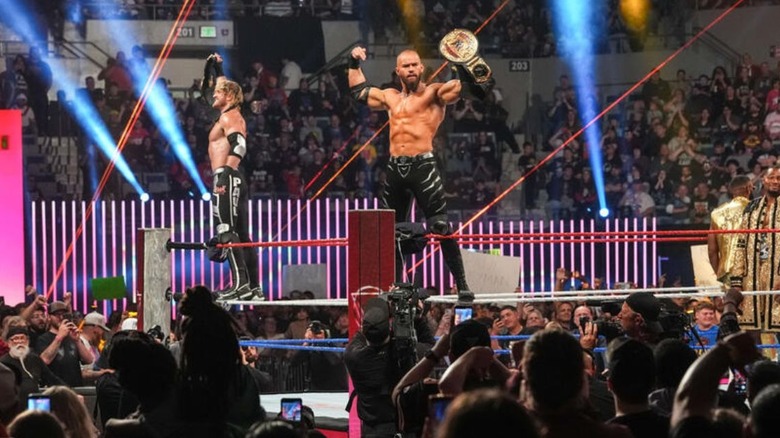 Logan Paul and Austin Theory hoist their World Tag Team Championships up as they stand on the turnbuckles ahead of their defense at Saturday Night's Main Event.