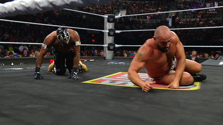 Rey and Rusev both down in the ring