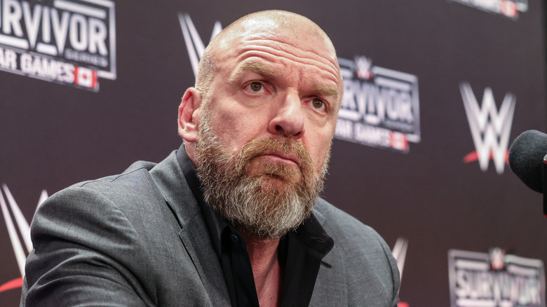 Triple H sternly looking over the Raw rundown
