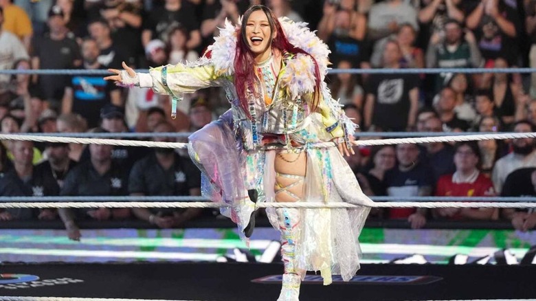 IYO SKY poses on the ropes before a match on 