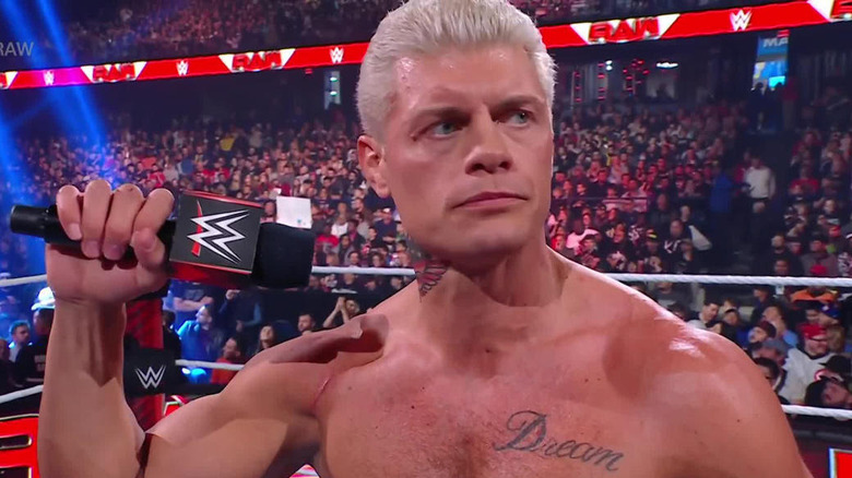 Cody Rhodes holding up a WWE microphone